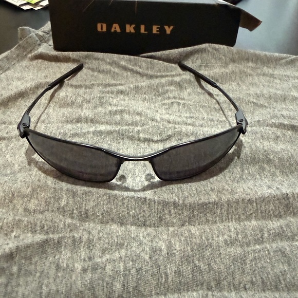 Oakley Black Frame Sunglasses with Dark Lenses